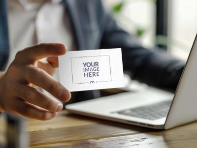 Business Card Mockup Held By Corporate Employee