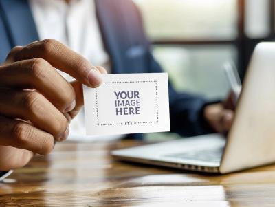 Business Card Mockup with Laptop and Corporate Employee Background