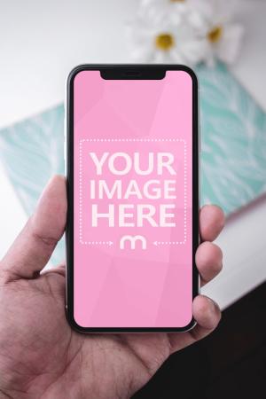 Closeup Man Holding iPhone XS Mockup Generator