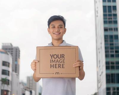 Delivery Package Mockup Held By South Asian Man