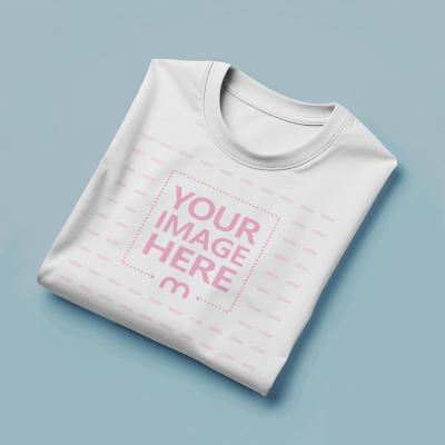 Folded T-Shirt Mockup Generator in Light Blue Background