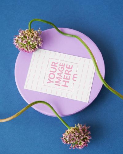 Greeting Card with Flowers on Blue Surface Mockup