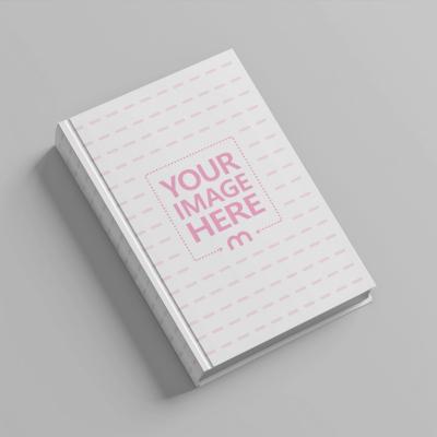 Hardcover Book Mockup Laid on Isolated White Background