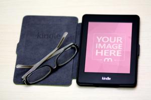 Kindle E-reader  and Glassed on Desk Mockup