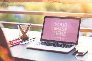 Macbook on Sunset Balcony Background Mockup