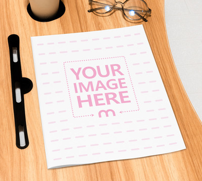 Mockup of a Magazine Cover on Top of a Brown Table