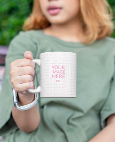 Mockup of a Mug With a Brown Hair Woman Giving it Out