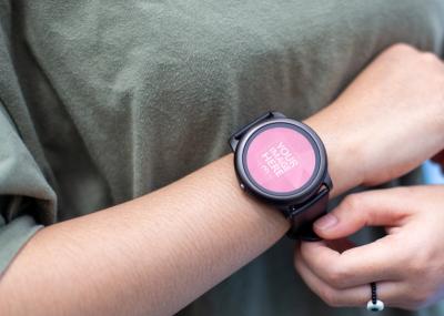 Mockup of a Rounded Smartwatch Below a Woman's Chest