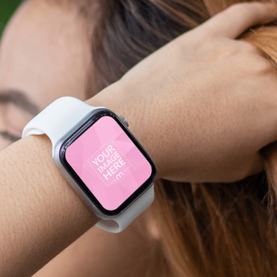 Mockup of a Rounded Smartwatch Featuring a Woman Stroking Her Brown Hair