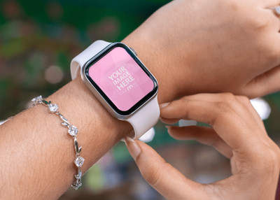 Mockup of a Smartwatch Featuring a Woman Browsing on it