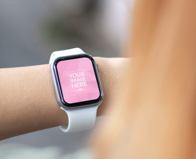 Mockup of a Smartwatch with Brown Hair Woman Watching on it