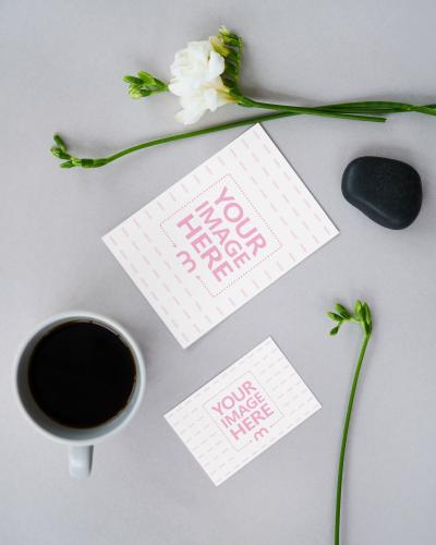 Paper Cards on Decorated Table with Coffee Mockup