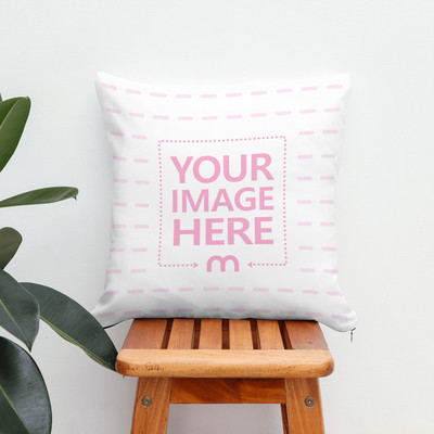 Pillow on Wooden Stool Next to Plant Mockup