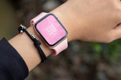 Pink Smartwatch Mockup with the Ground as the Out of Focus Background