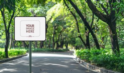 Rectangular Street Sign Mockup on a Road with Trees