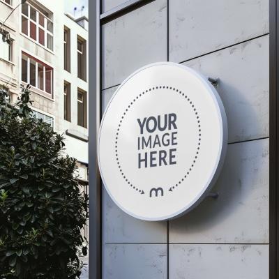 Round Signage Mockup Outside Large Building