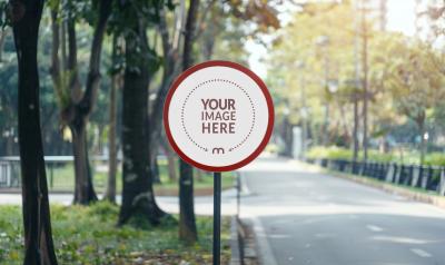 Round Street Sign Mockup on a Forested Road