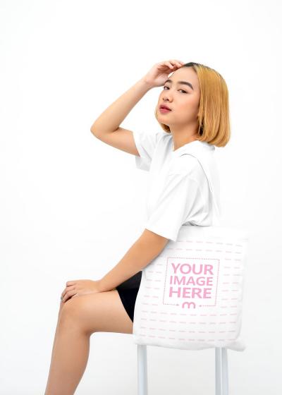 Shirt and Bag Mockup of a Sitting Woman