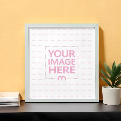 Square Sized Poster & Art Frame Mockup Against Yellow Wall