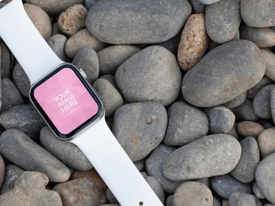 Tilted Smartwatch Mockup On top of the Stones as the Flooring