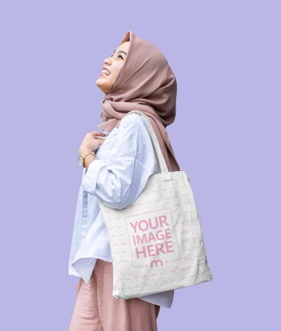 Tote Bag Mockup Featuring a Laughing Woman