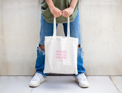 Bag Mockup with A Woman Showing Her Tote Bag