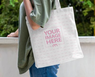 Tote Bag Mockup With  a Woman Facing on the Side