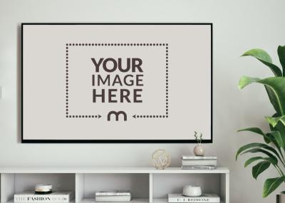 TV Screen Mockup with Books and Green Leaves