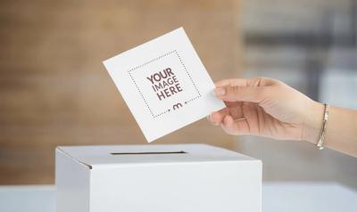 Voting Ballot Paper Mockup with Woman's Hand Placing It in Box