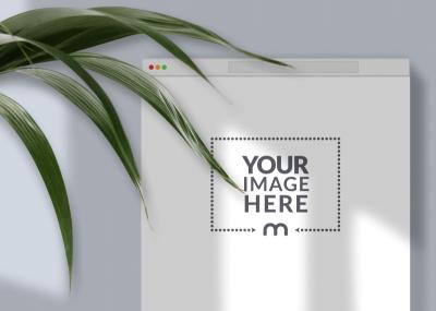 Website Screen Mockup Surrounded by Leaves on Wall