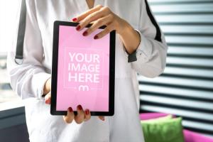 Woman Displaying Portrait Tablet Computer Screen